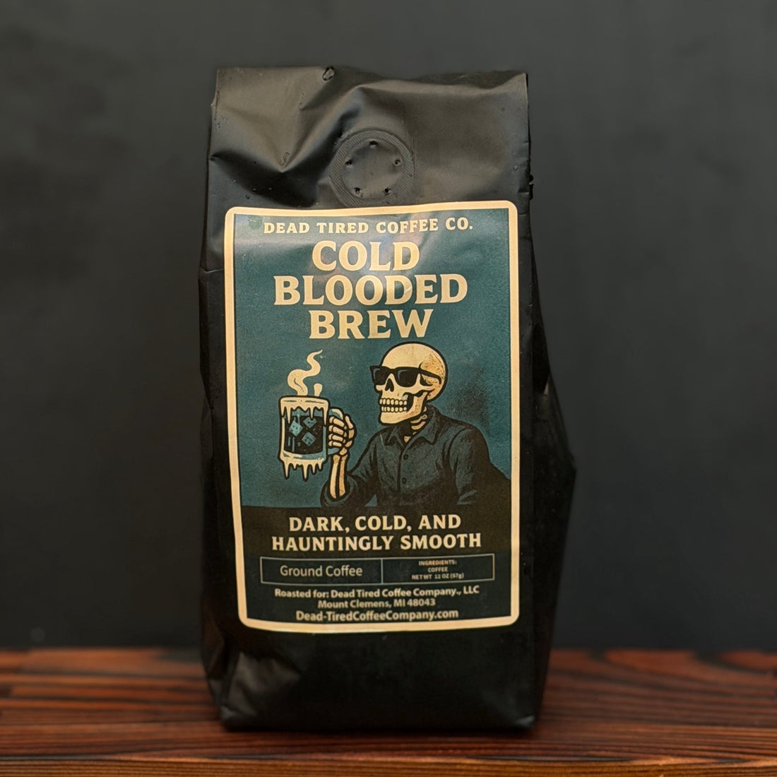 Cold Blooded Brew coffee bag on a wood table