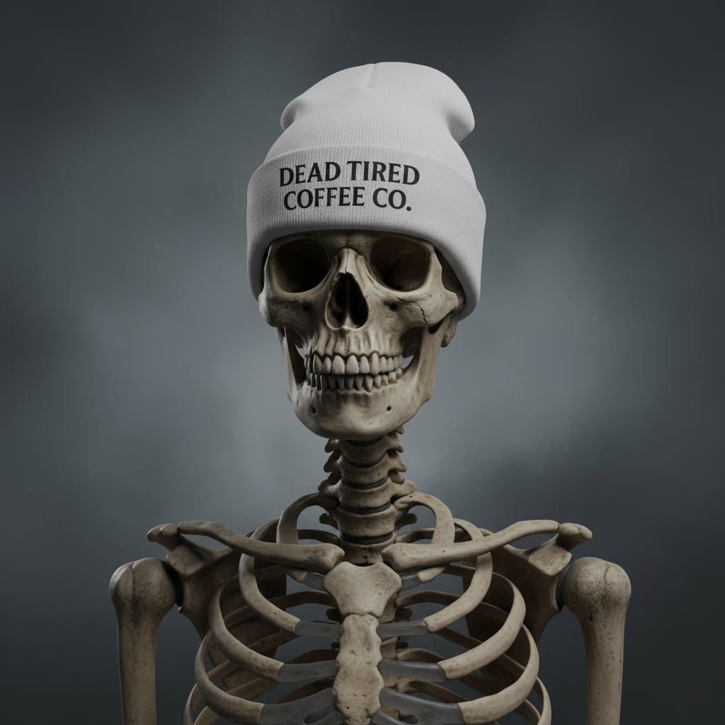 Gray beanie with 'DEAD TIRED COFFEE CO.' text on a white background