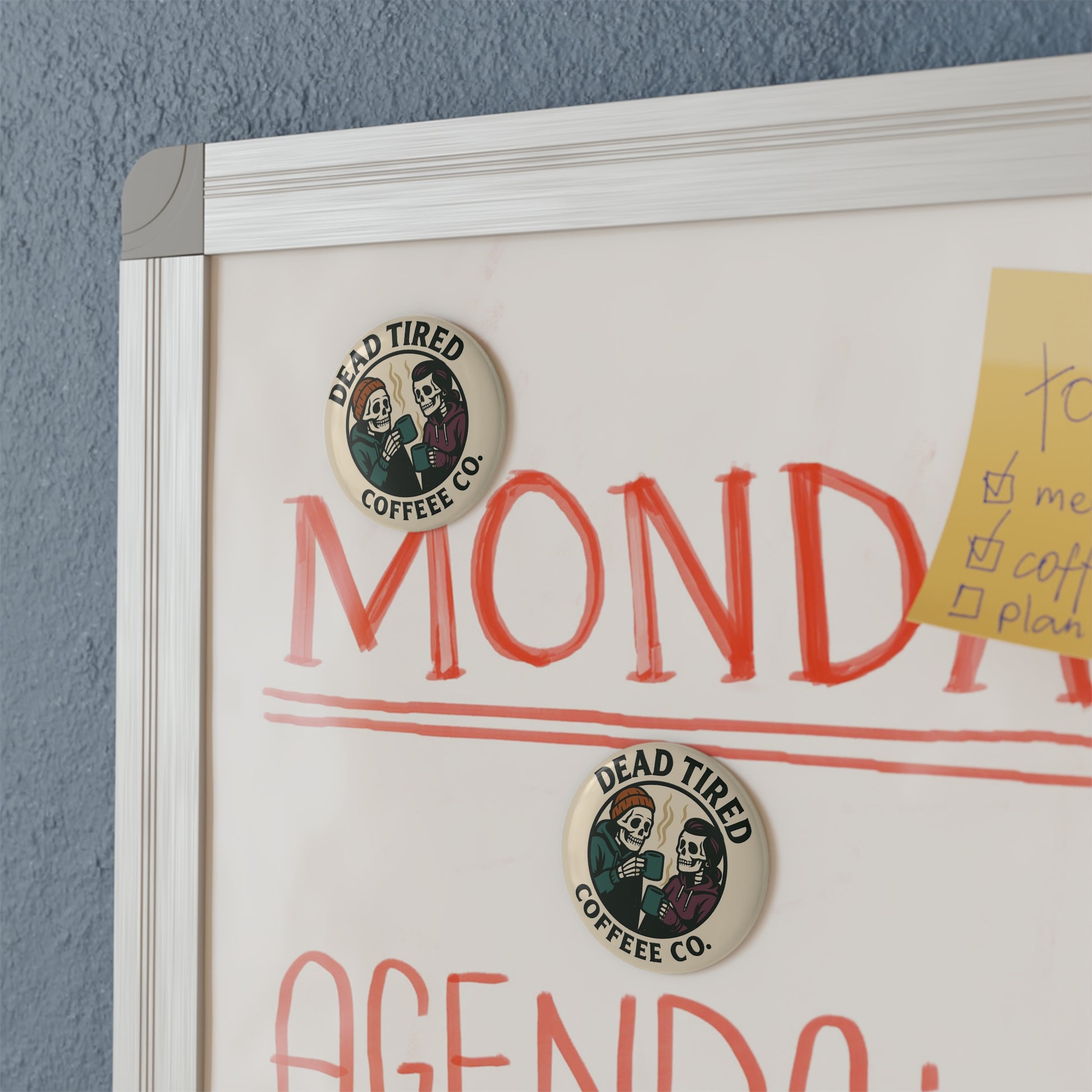 Whiteboard with 'Monday' and 'Agenda' text, featuring Dead Tired Coffee Co. logos.