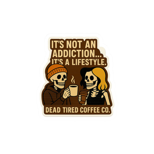 Sticker with skeletons drinking coffee and text 'It's not an addiction... it's a lifestyle. Dead Tired Coffee Co.'