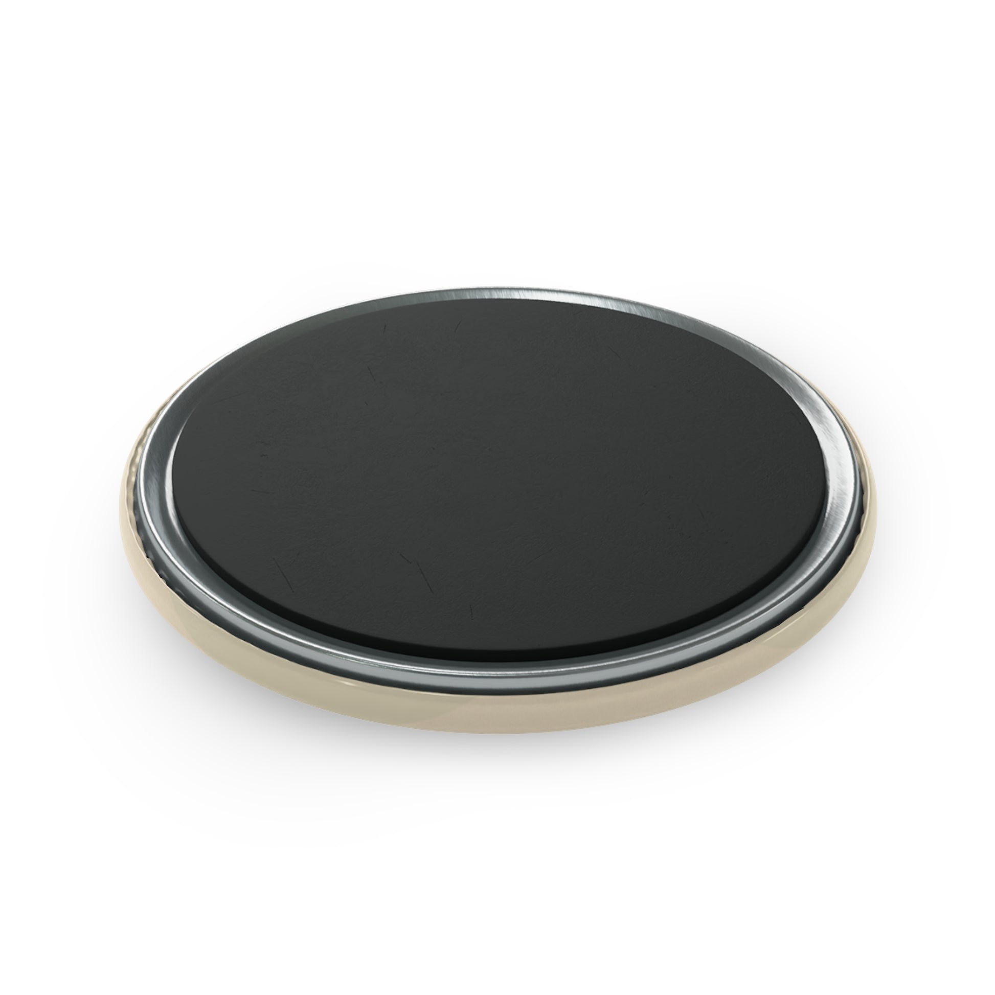Round black object with gold rim on a white background