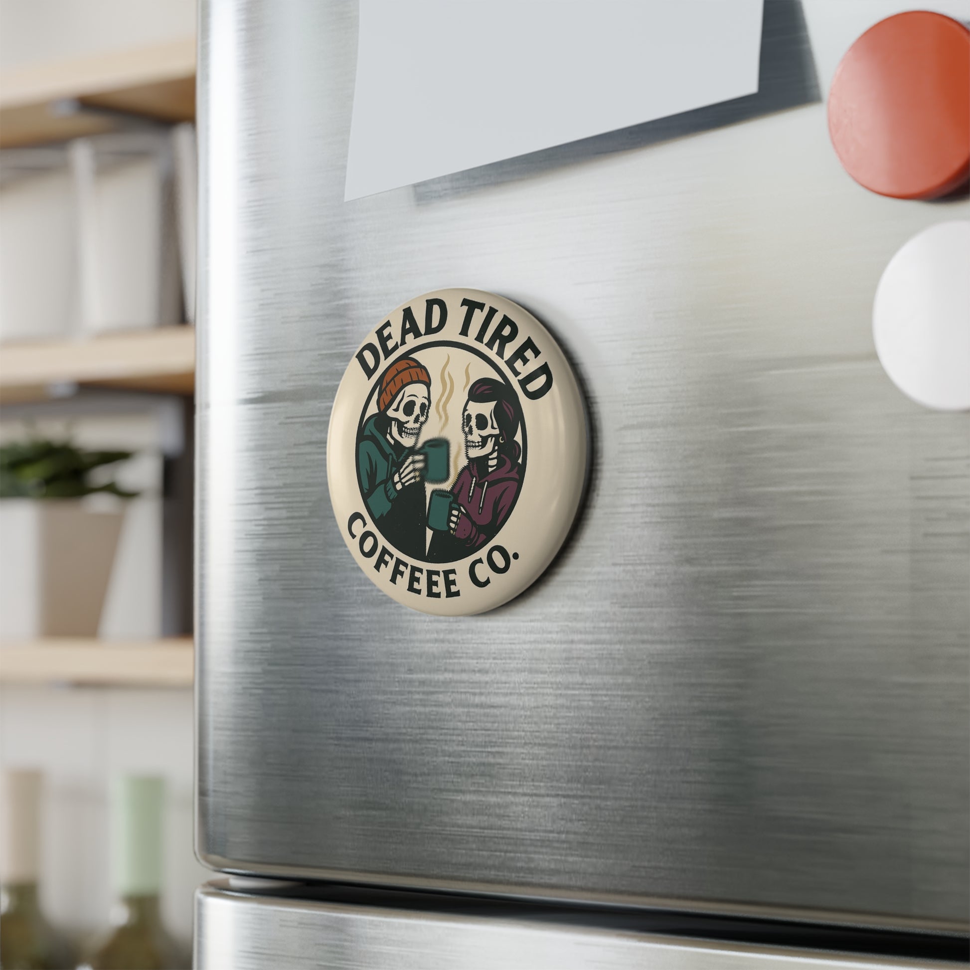 Dead Tired Coffee Co. magnet on a refrigerator with a blurred background