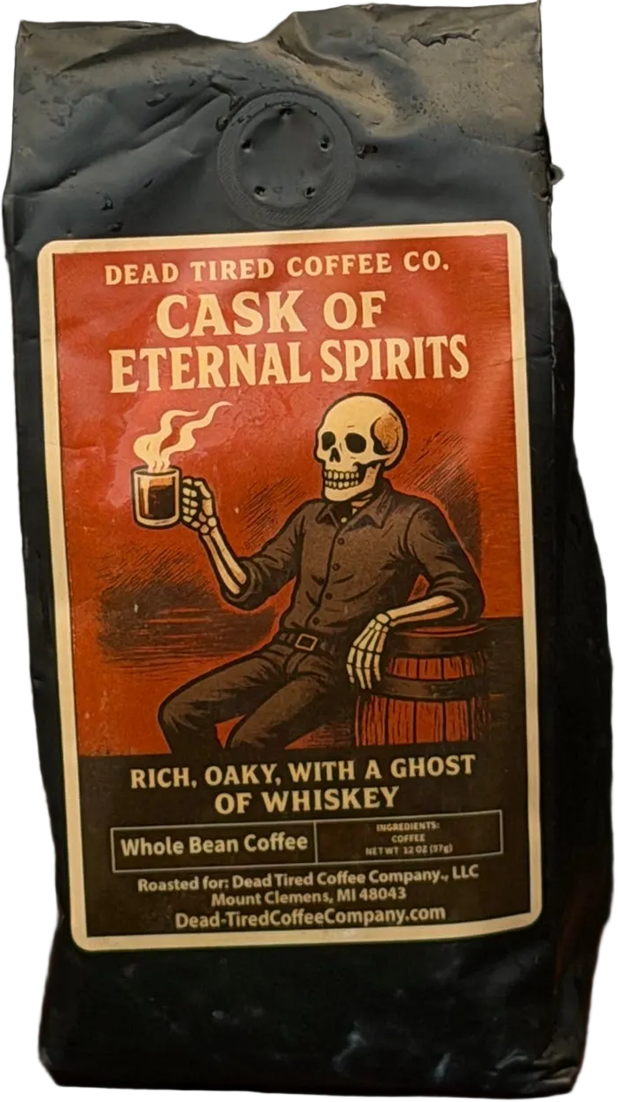 Cask of Eternal Spirits coffee bag by Dead Tired Coffee Co. The rust-red label shows a skeleton raising a steaming mug beside a barrel, a nod to its whiskey barrel-aged Guatemala coffee.