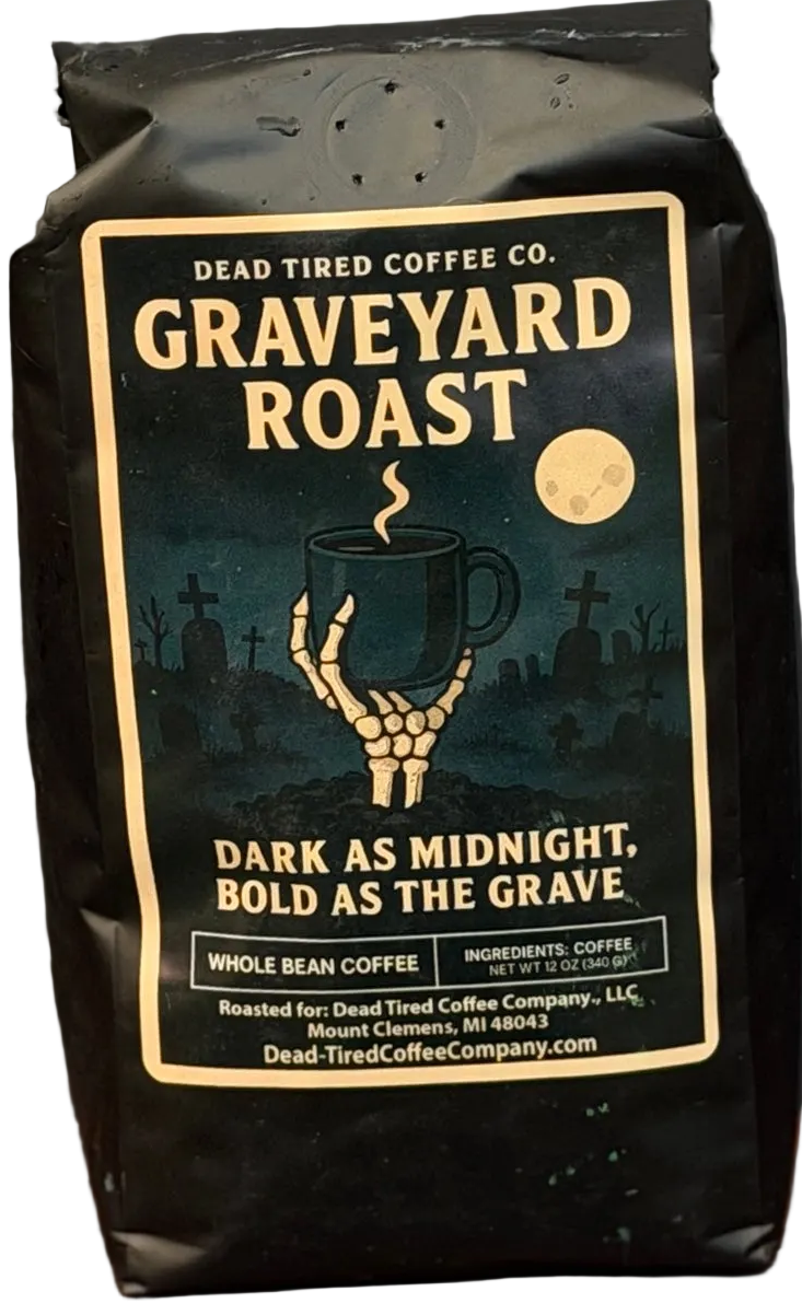 Graveyard Roast coffee bag by Dead Tired Coffee Co. Its midnight graveyard label shows a skeletal hand lifting a steaming mug beneath the moon; inside is a specialty-grade six-bean dark roast.