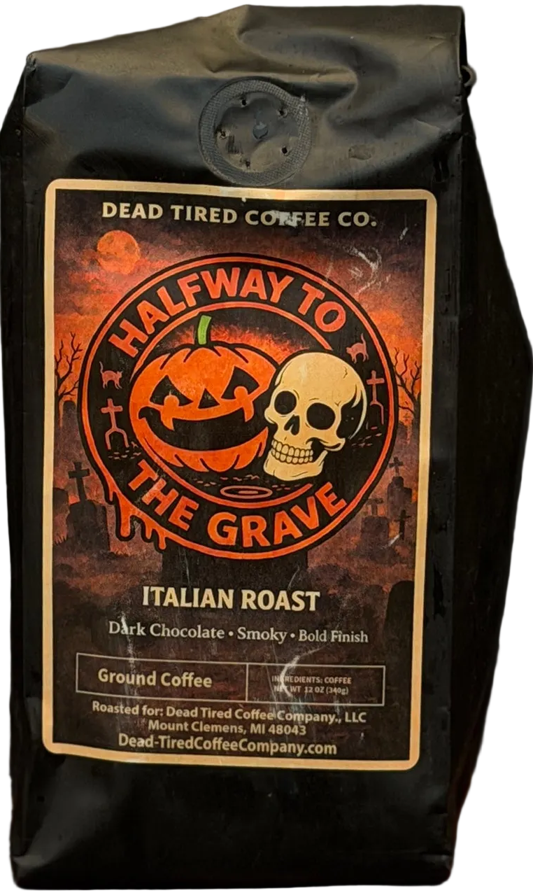 Halfway to the Grave Italian dark roast coffee bag by Dead Tired Coffee Co. A grinning jack-o'-lantern and skull sit in a graveyard on the Halloween label of this bold coffee.