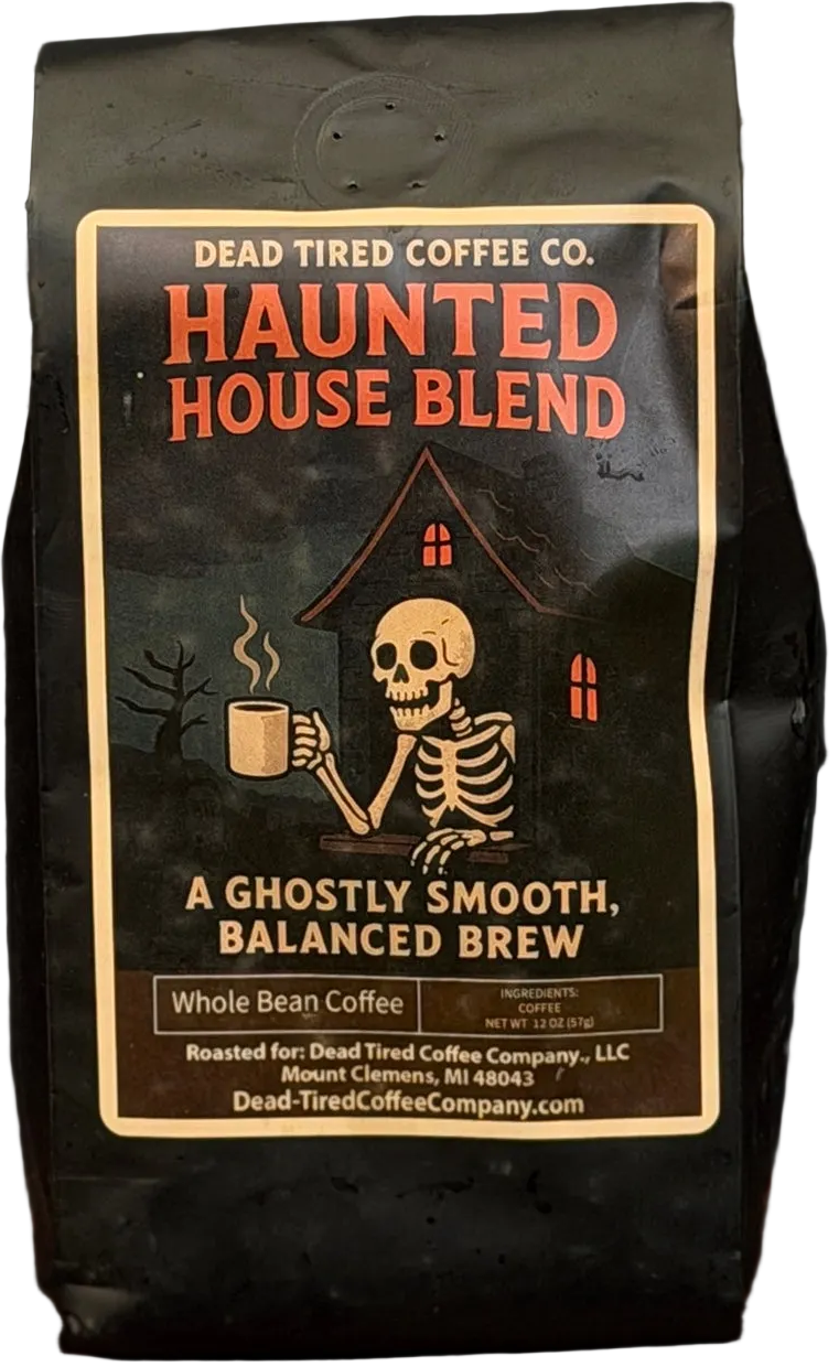 Haunted House coffee bag by Dead Tired Coffee Co. Its dark label shows a skeleton holding a steaming mug before a haunted house; inside is medium roast, single-origin Peru coffee.