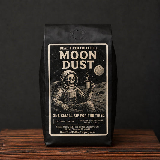 Moon Dust instant coffee in a black Dead Tired Coffee Co. bag with skeleton astronaut label