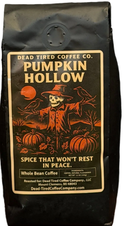 Pumpkin Hollow pumpkin spice coffee bag by Dead Tired Coffee Co. Its spooky harvest label shows a skeleton scarecrow among pumpkins and crows under an orange moon.